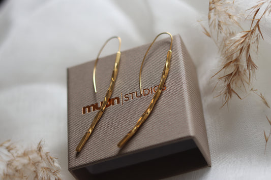 Guld snoet øreringe