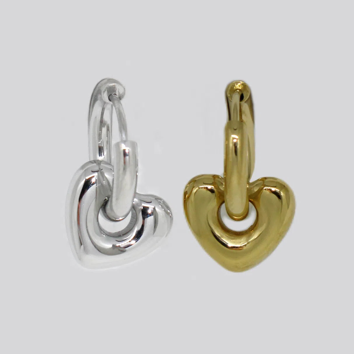 Hjerte øreringe i guld og sølv