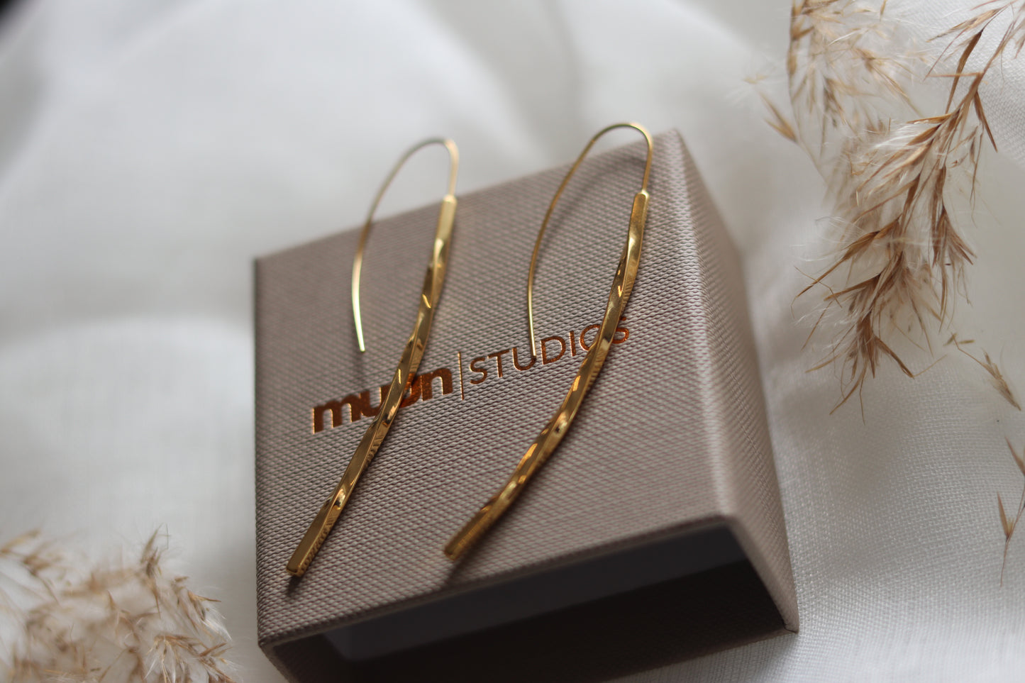 Guld snoet øreringe