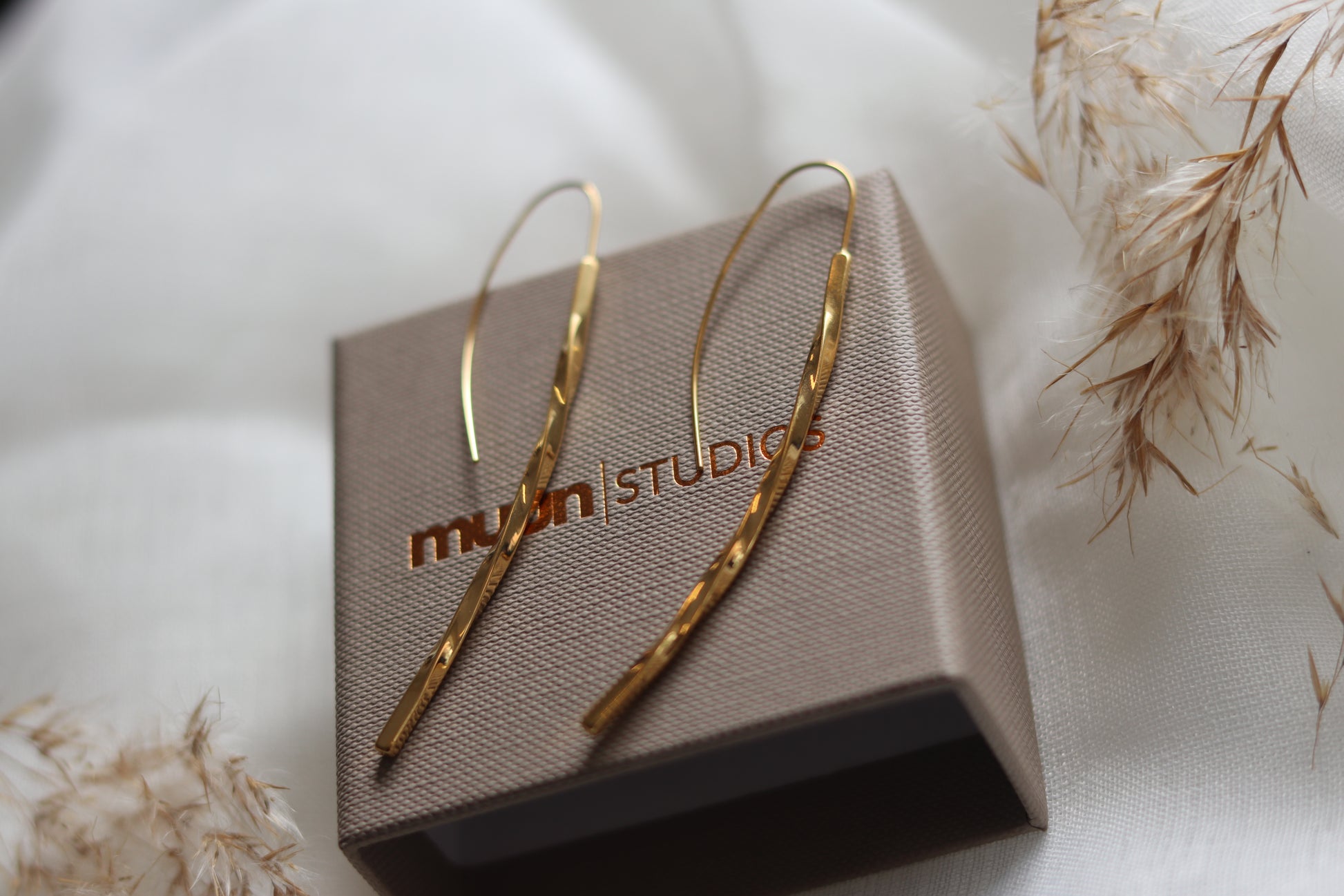 Guld snoet øreringe